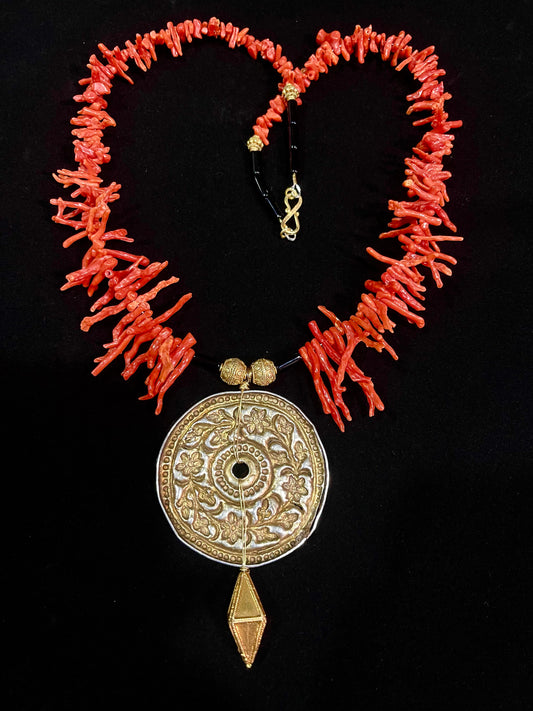 Antique silver disc pendant with a gold wash, strung with coral and silver gold plated beads