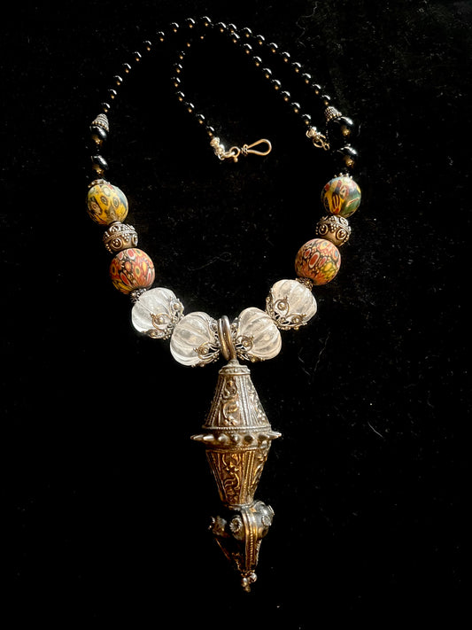 Vintage Omani silver and gold washed earring.