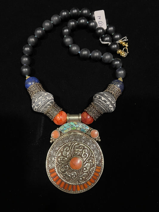 Tibetan coral and silver pendant