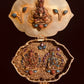 The Open Gau displays a figure of the goddess Tara using coral and emerald, On the  inside of the Gau are 2 figures of deities - one of coral and the other of emeralds